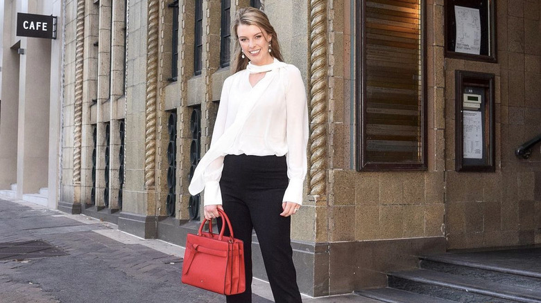 Lawyer holding stylish red bag