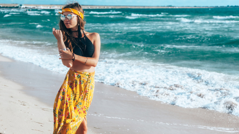 woman in maxi skirt on beach
