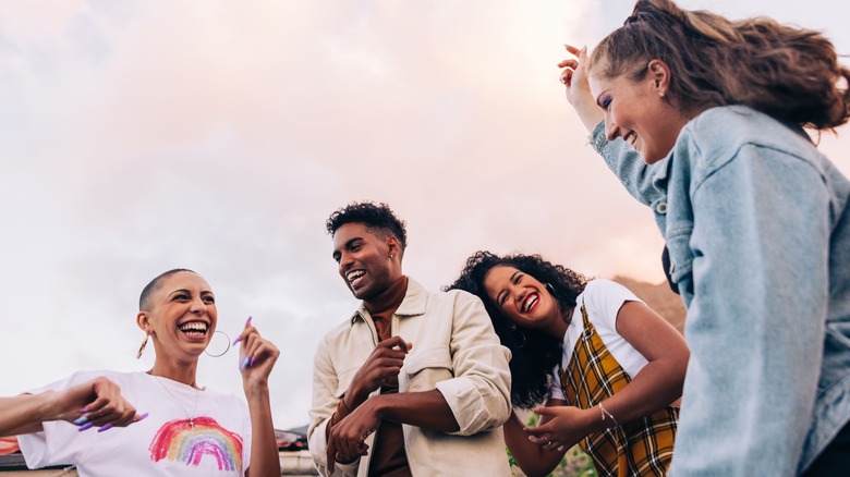 four smiling friends