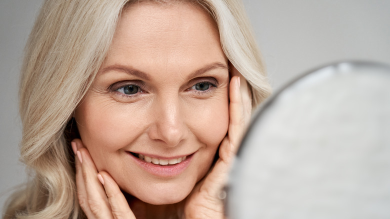 Woman touching her face