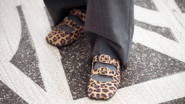 A pair of strappy leopard-print ballet flats.