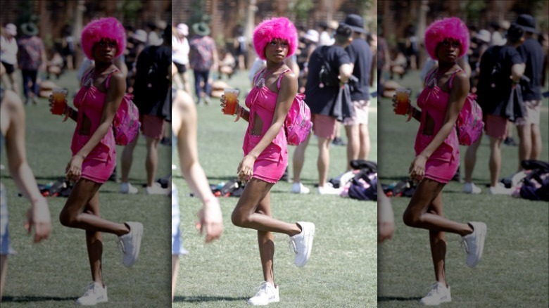 Woman wearing pink, white sneakers