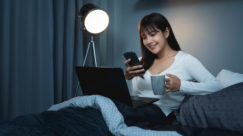 Woman in bed with laptop