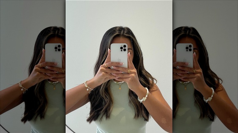 woman wearing thin fashion rings