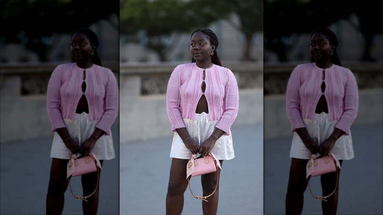 woman wearing light pink outfit