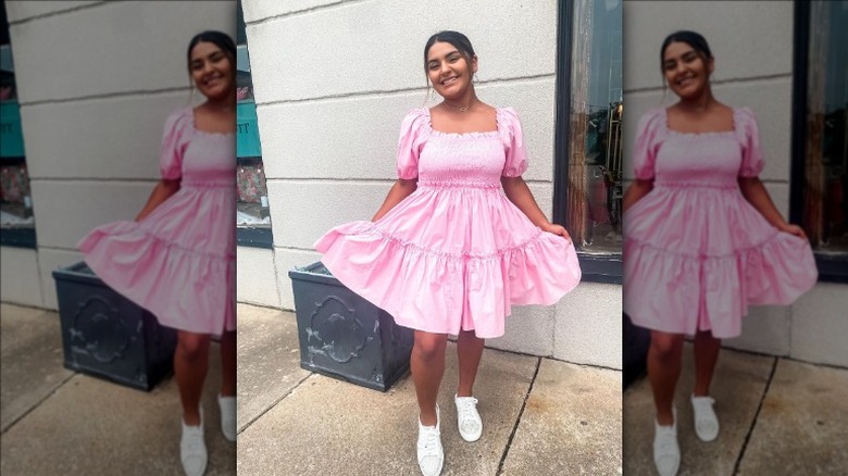 Woman wearing a pink babydoll dress