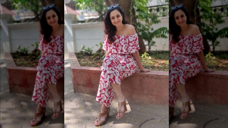 Woman wearing a sleeveless floral jumpsuit