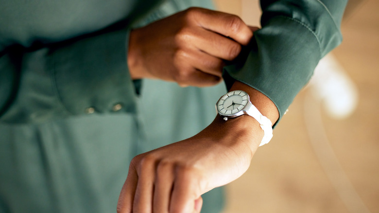 woman checking watch