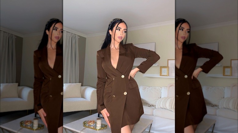 Woman wearing brown suit dress