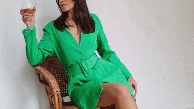Woman wearing green suit dress