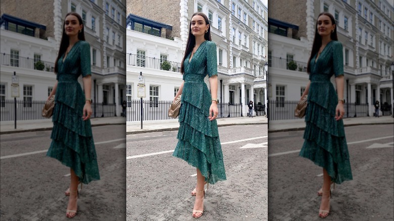 woman in green ruffled dress