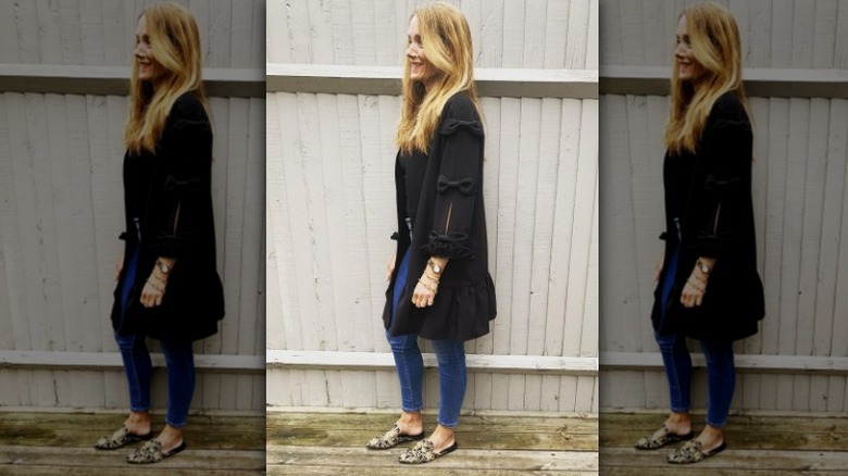 woman in black jacket with bowties