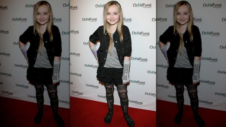 Sabrina Carpenter at the "Kids Helping Kids: Japan" premiere in armbands and tights