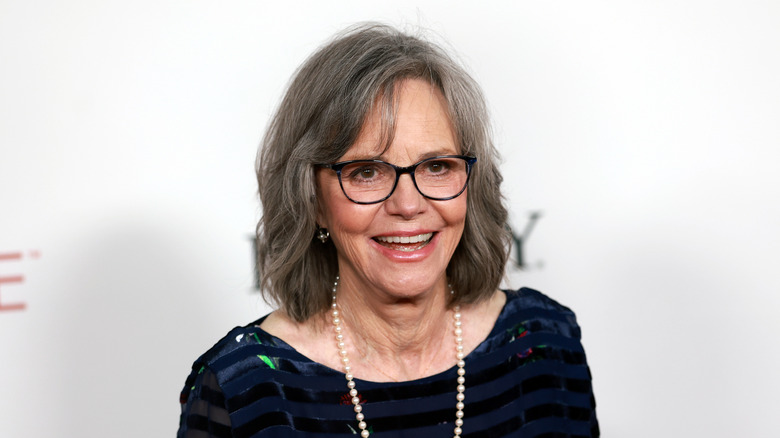 Sally Field smiling on a red carpet