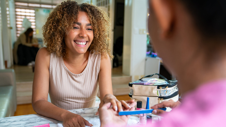 Woman getting her nails done