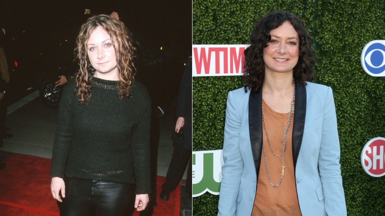 Sara Gilbert wearing black sweater and blue blazer