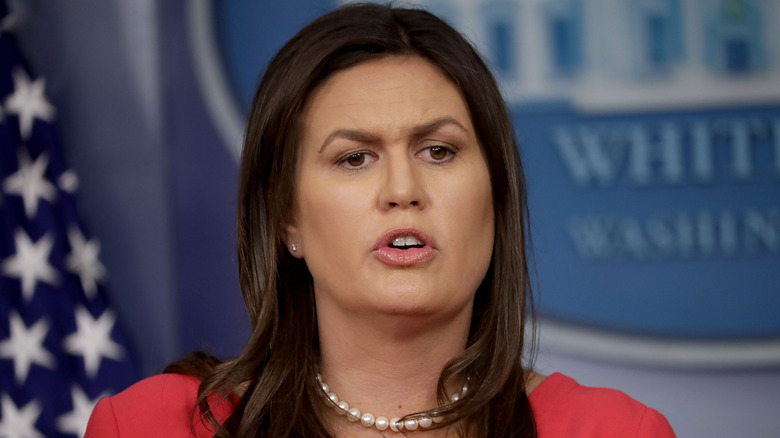 Sarah Huckabee Sanders in a red dress