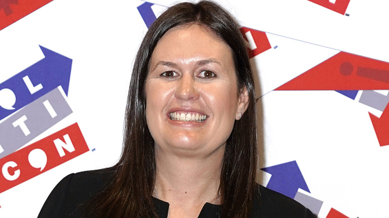 Sarah Huckabee Sanders wearing a black dress