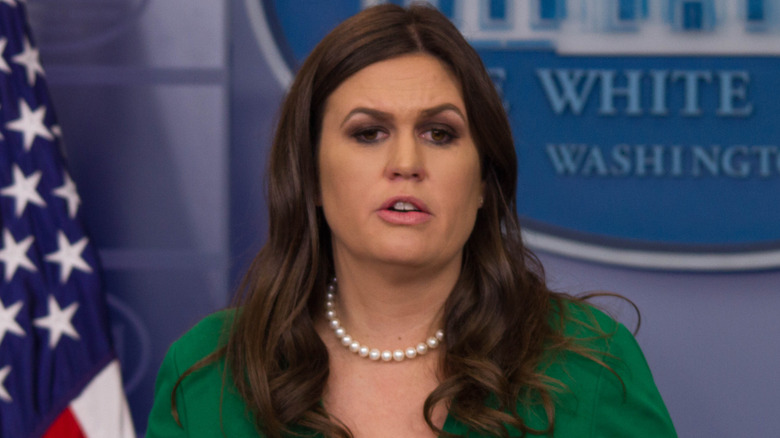 Sarah Huckabee wearing a green dress with pearl necklace
