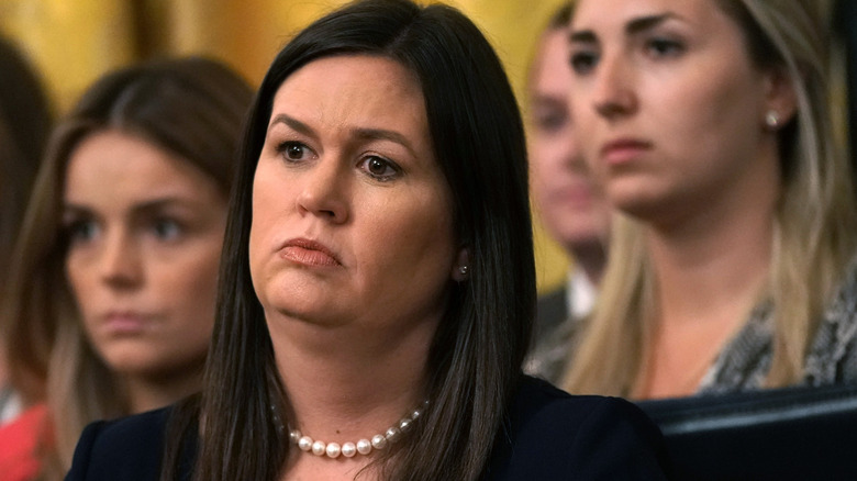 Sarah Huckabee Sanders with an unhappy look on her face during an official meeting