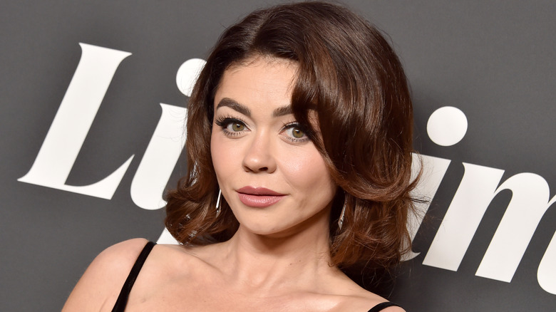 Sarah Hyland poses on the red carpet with short hair