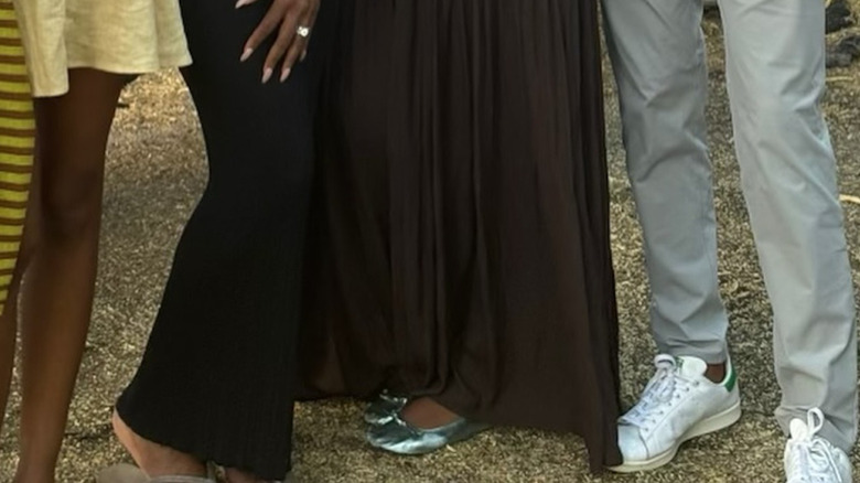 A close up of Sasha Obama's metallic ballet flat shoes