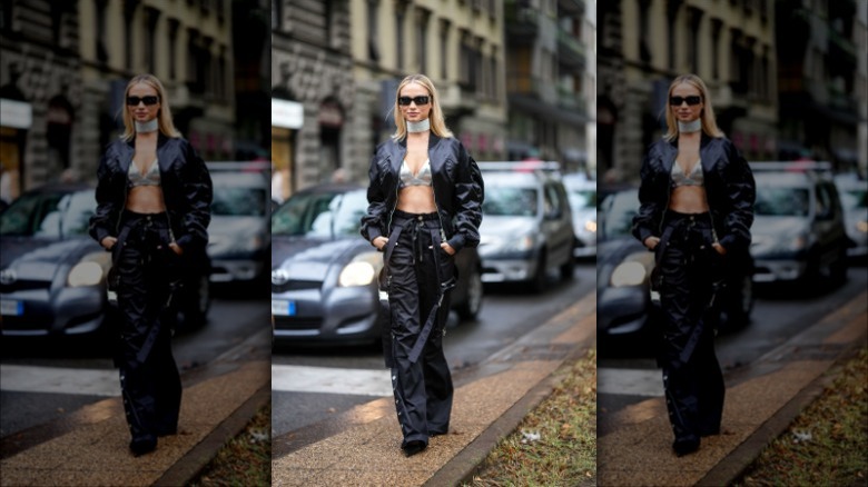 woman wearing black satin pants