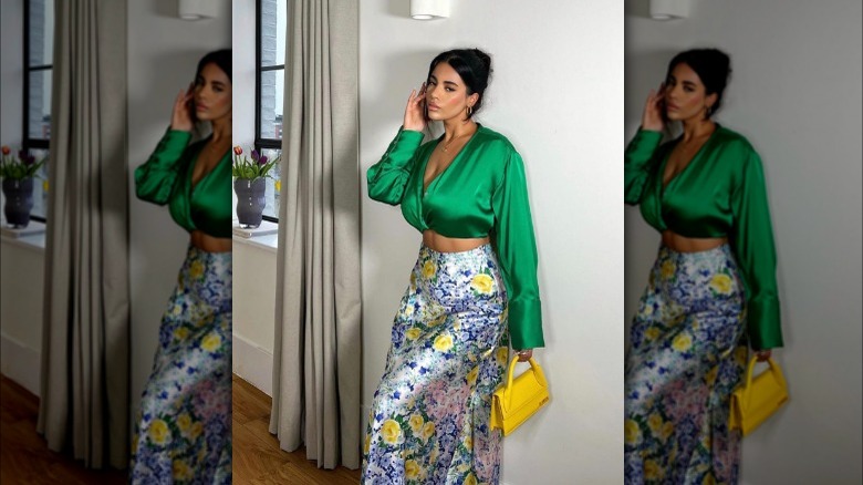 A woman wearing a satin outfit