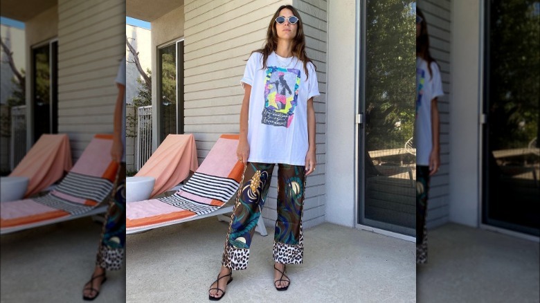 A woman wearing satin pants