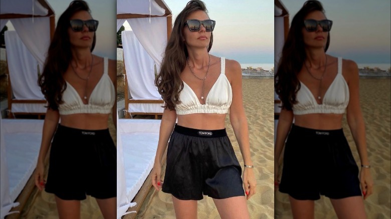 A woman wearing satin shorts