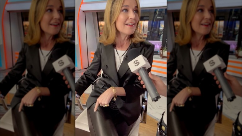 Savannah Guthrie sits at The Today Show desk in leather pants