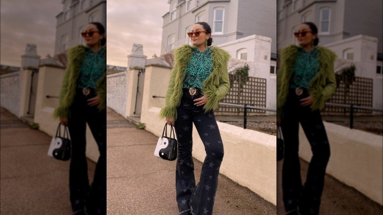 A woman wearing multiple statement pieces