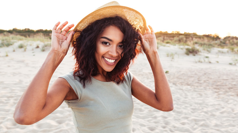 smiling woman wearing hat