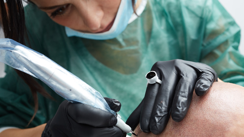 scalp micropigmentation technician tattooing scalp