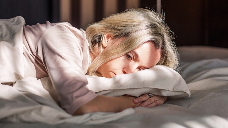Woman lying in bed