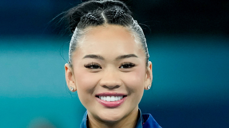 Suni Lee pink lip gloss smiling