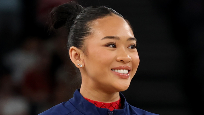 Suni Lee blue jacket diamond earrings