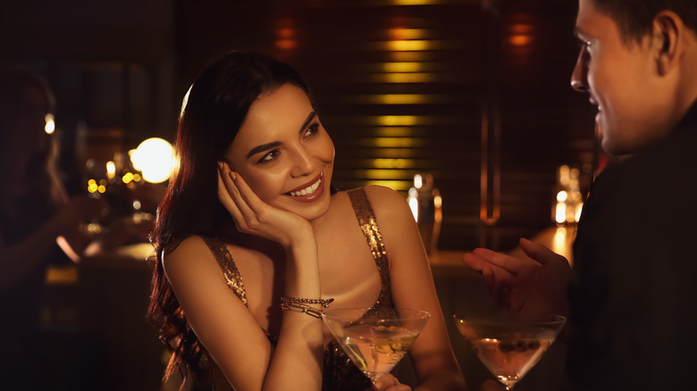 Woman smiling at man