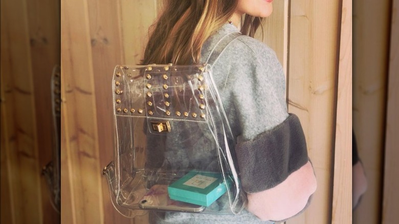 Woman with clear backpack