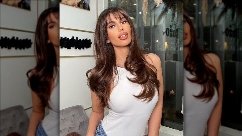 woman looking glamorous with bangs