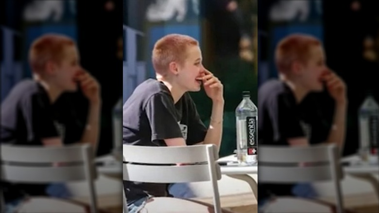 Shiloh Jolie-Pitt with pink buzz cut