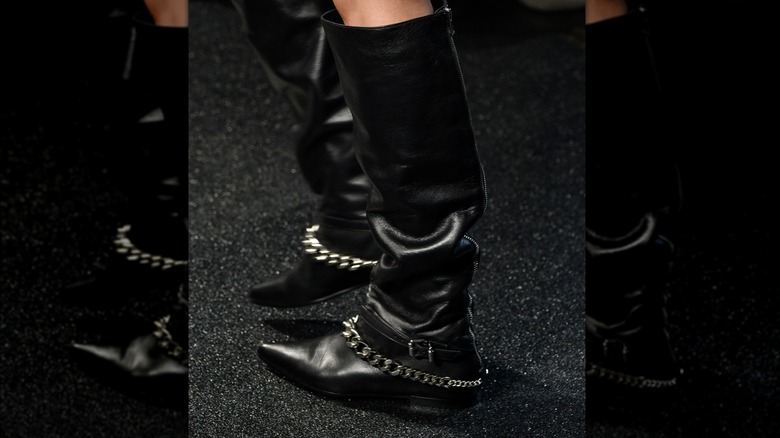 Boots with metallic buckle and chains