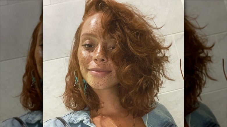 Woman with side part bob