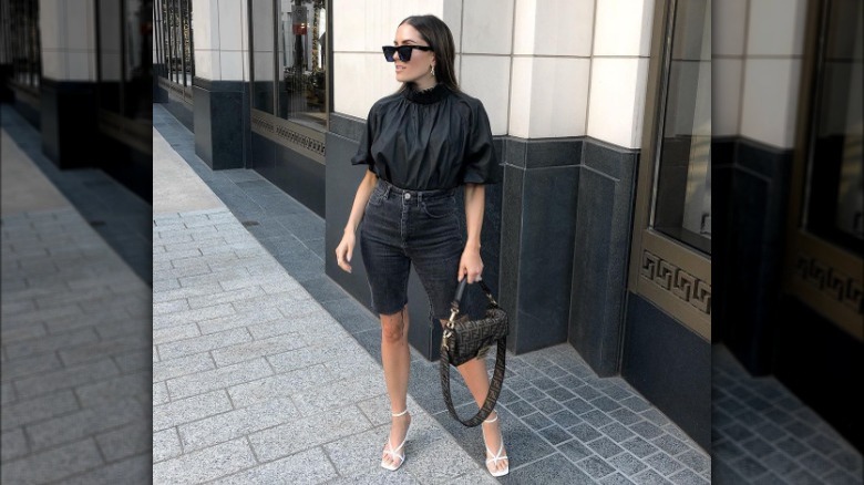 Women models black denim shorts 