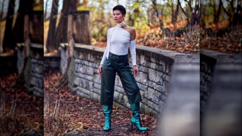 Woman models long leather shorts 