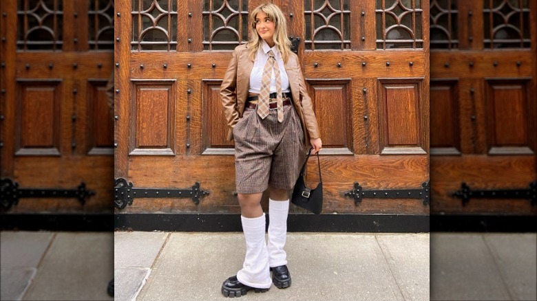 Woman models brown plaid shorts 