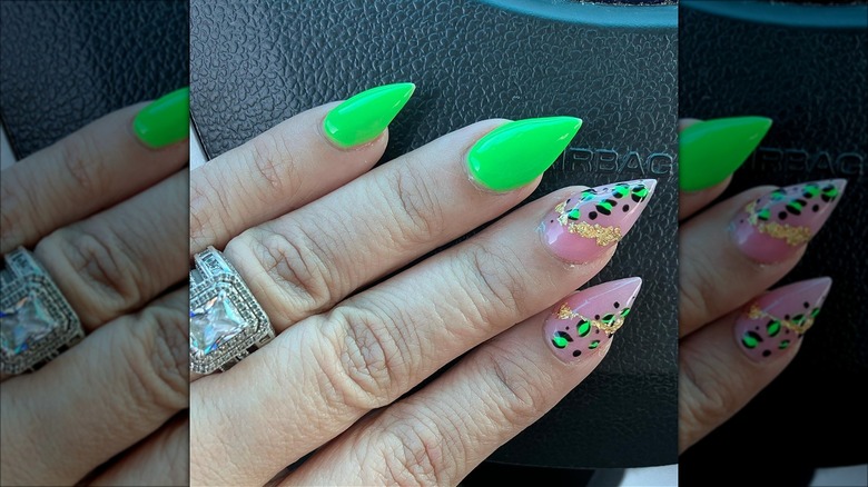 hand with lime green short stiletto nails