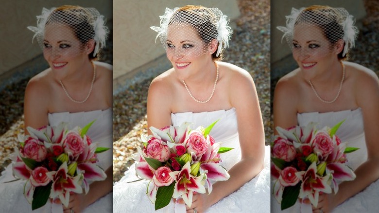 Bride wearing birdcage veil