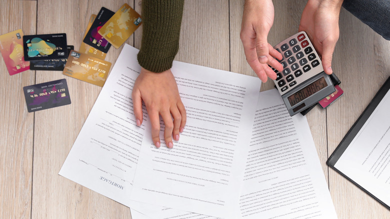 A couple sorting through bills