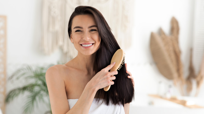 woman brushing her hair